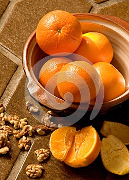 Oranges in a bowl on Spanish tile