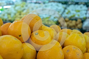 Oranges on boxes in supermarket