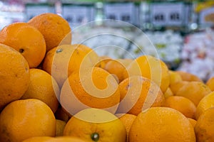 Oranges on boxes in supermarket