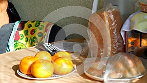 Oranges and bread on the table
