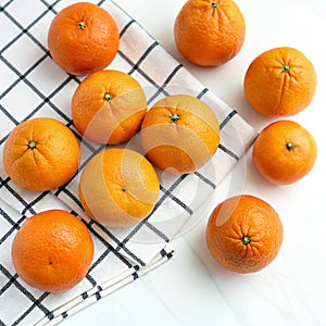 Oranges on a checkered background on white background