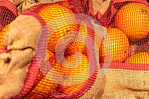 Oranges in close-up in eco-friendly canvas packaging. Taking care of the environment. Environmental friendliness. Zero