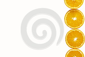Oranges cut into round slices isolated on white background. Tropical fruit