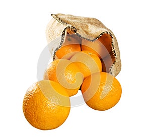 Oranges falling from sack isolated