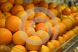 Oranges fruit inside plastic crate at supermarket