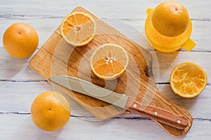 Oranges, orange juice and slices of fruit photo