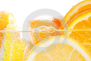 Oranges and lemons in water