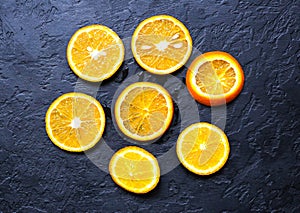 Oranges lying black background. Still life photo. Healthy style. Fruit and nature