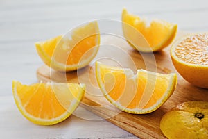 Oranges, orange juice and slices of fruit photo