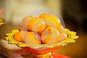 Oranges pile, on gold plated for worship in the Chinese New Year.chinese New Year`s Eve Celebration.