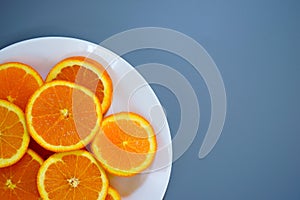 oranges on a plate on a sunny day photo