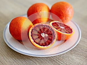 Oranges in the plate - tarocco blood orange - sanguine orange - red orange