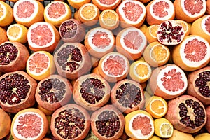 Oranges and pomegranates cut in half ready for juicing. Street market, Istanbul