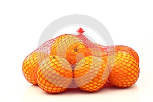 Oranges in a red plastic net