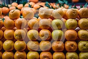 Oranges stacked on market stall, vibrant citrus fruit display photo