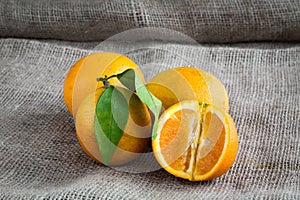 Oranges on table background and woven sack