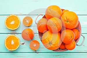 Oranges and Tangerines in retro colander.