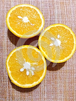 Oranges are three halves. Three juicy halves of an orange.