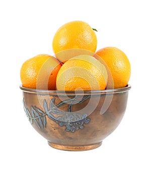 Oranges in vintage metal bowl