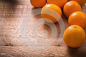 Oranges on vintage wooden board with organized