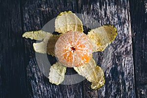 Oranges on wooden table with black shadow