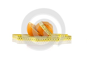 Oranges wrapped with a white tape measure. Healthy, organic food and diet concept.