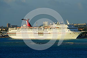 Oranjestad, Aruba - November 17, 2018 - Carnival Ecstacy cruise ship docked by the port