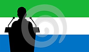 Orator Speaking From Tribune Sierra Leone Flag Background. Public Speaker Speech In Sierra Leone