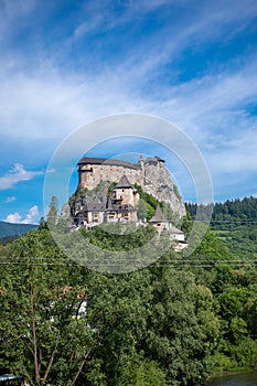 Orava castle on hill, river and forest, Slovakia