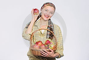 Orchard, gardener girl with apple basket. organic and vegetarian. healthy teeth. vitamin and dieting food. Happy woman