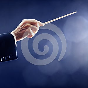 Orchestra conductor hand conducting