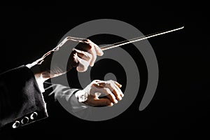 Orchestra conductor hands baton