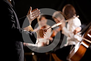 Orchestra conductor on stage photo