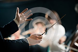 Orchestra conductor on stage photo