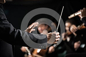 Orchestra conductor on stage photo