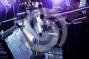 Orchestra music stands. Performance on the stage of a brass symphony orchestra.