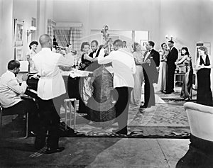 Orchestra playing and couples dancing