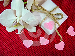 Orchid and hearts on red cloth, Valentines Day background, wedding day