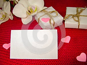 Orchid and hearts on red cloth, Valentines Day background, wedding day.