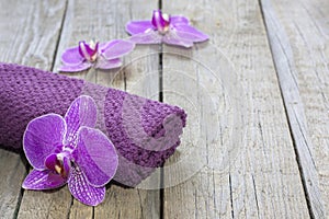 Orchid on wooden boards spa cosmetic abstract background