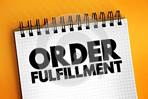 Order fulfillment - complete process from point of sales inquiry to delivery of a product to the customer, text concept on notepad