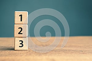1, 2, and 3 priority numbers by wood cubes
