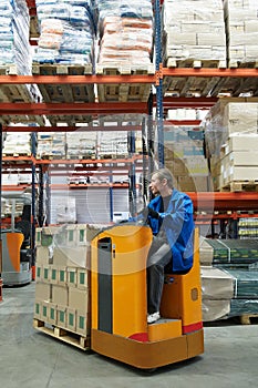 Order picker loader in warehouse photo