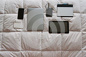 Ordered devices on bed with space