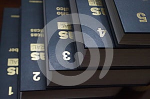 Golden numbers on a enciclopedia from one to five photo