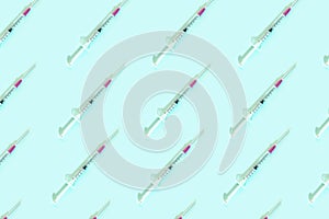 Ordered pattern with syringes. Coronavirus vaccine concept