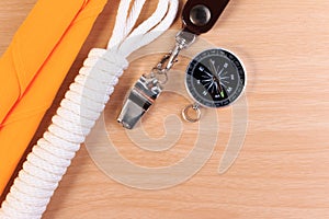 Orderliness white scout rope, scarf, whistle and compass.