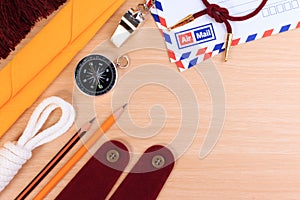 Orderliness white scout rope, scarf, whistle, pencil, compass, envelope and blank shoulder epaulette. photo