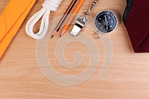 Orderliness white scout rope, scarf, whistle, pencil, compass and red beret.