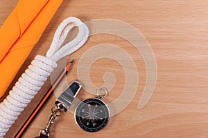 Orderliness white scout rope, scarf, whistle, pencil and compass. photo